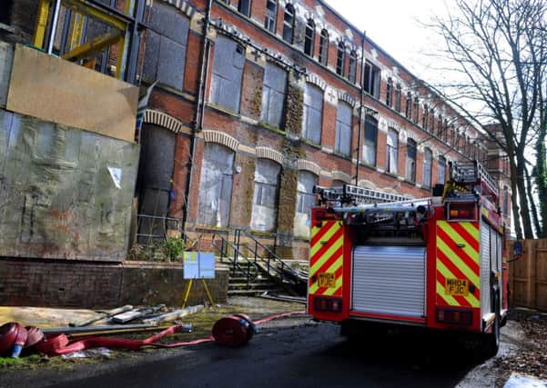 Firefighters at the scene of a fire at the former Pagefield College derelict building, Bridgeman Terrace, Wigan