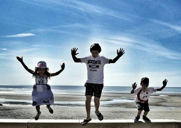 Liam Hesmondhalgh, 12,  Maddie Coyne, 7,  and Isaac Coyne, 8 enjoy the sun in Blackpool