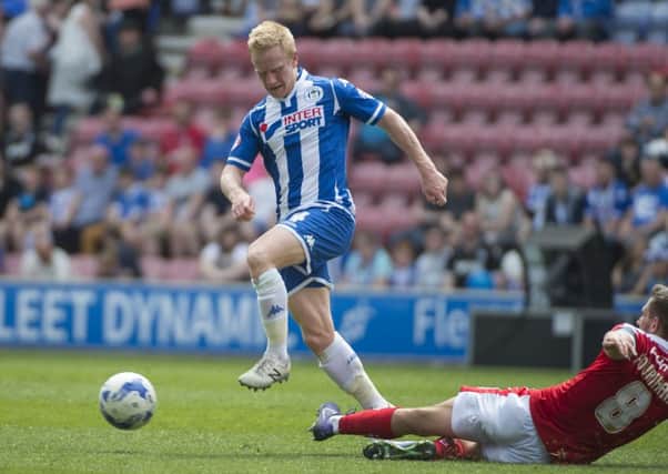 Wigan Athletic midfielder David Perkins in action against Barnsley
