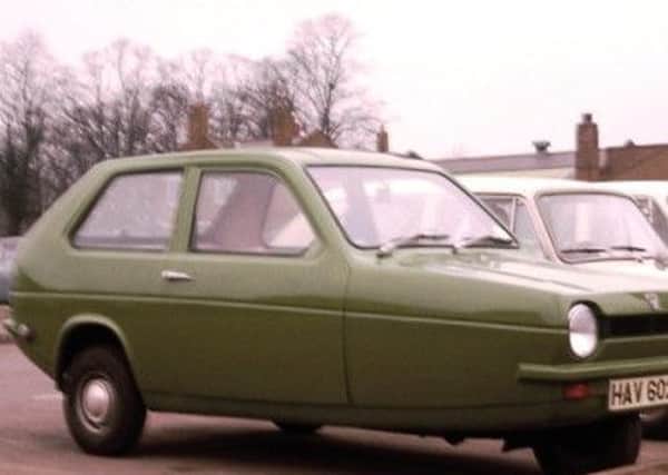 A Reliant Robin similar to the one that caught fire