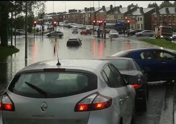 Cars submerged in water at Marus Bridge at tea time on Wednesday