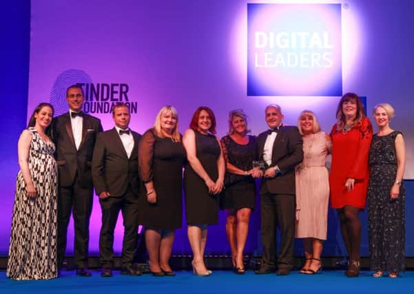 The Wigan Council team and chiefs pick up their digital award