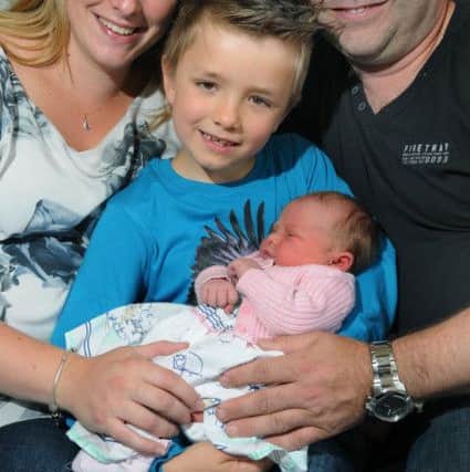Warren and Danielle with son Charlie, six, and baby Maisie