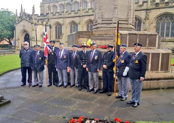 A whistle was blown and a two-minute silence started at 7.28am at Wigan's war memorial