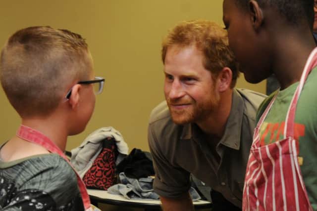 Prince Harry met children, staff and volunteers during a tour around Wigan Youth Zone, his last of three visits in the Wigan borough