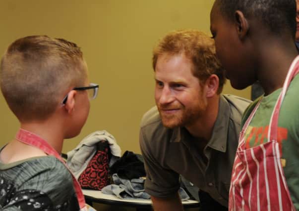 Prince Harry met children, staff and volunteers during a tour around Wigan Youth Zone, his last of three visits in the Wigan borough