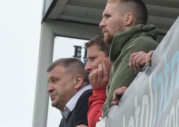 Shaun Wane, assistant John Winder and Sam Tomkins watch on as Wigan slide to a 62-0 drubbing at Wakefield