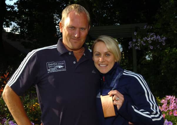 Jenny Meadows and her husband, and coach, Trevor Painter with the World Championships bronze medal from 2009