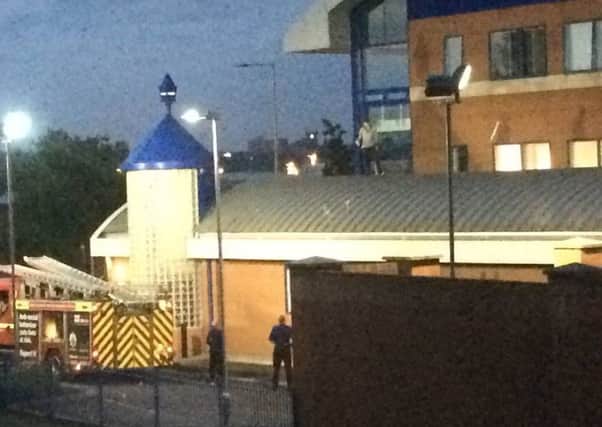 Teen arrested after climbing onto police station roof