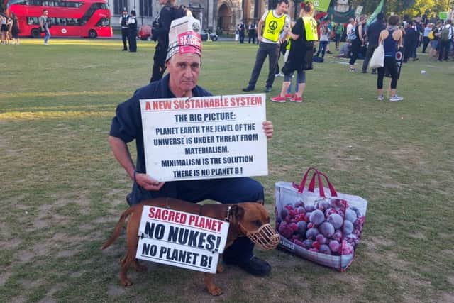 Protester Stuart Holmes with his Staffordshire Bull terrier at the anti-Trident demonstration in Parliament Square in London