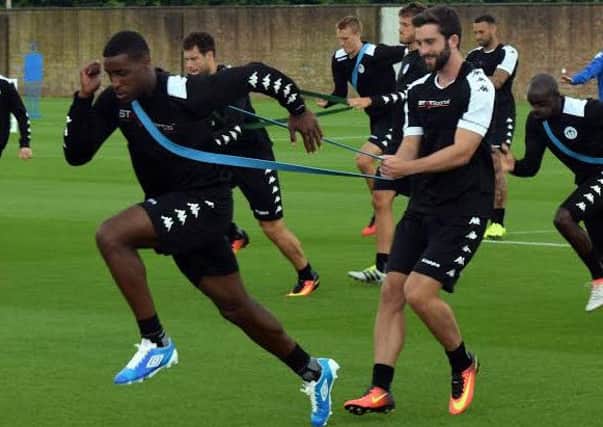 Will Grigg (right), training with team-mate Donervon Daniels