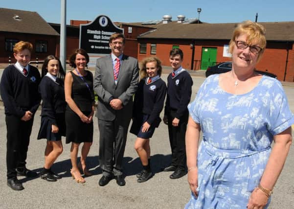 English teacher Faye Stockley, right, pictured with deputy head Lindsay Barker, third from left, and headteacher Andy Pollard, fourth from right
