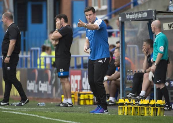 Gary Caldwell offers instruction from the sideline during the 4-1 loss to Rochdale on Saturday