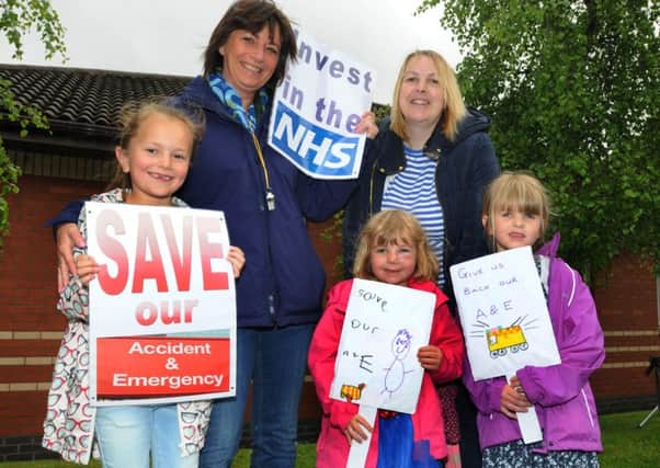 Susan Davies (back left) with Olivia, seven, and Alison Blease with Florence, five, and Millie, six, right, show their support