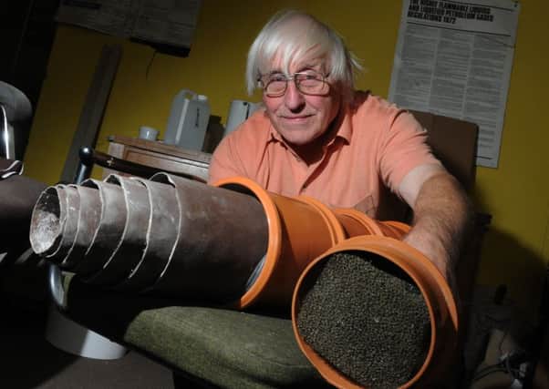 Ron Foster with a water filtration pipe used in pools and spas that kills diseases