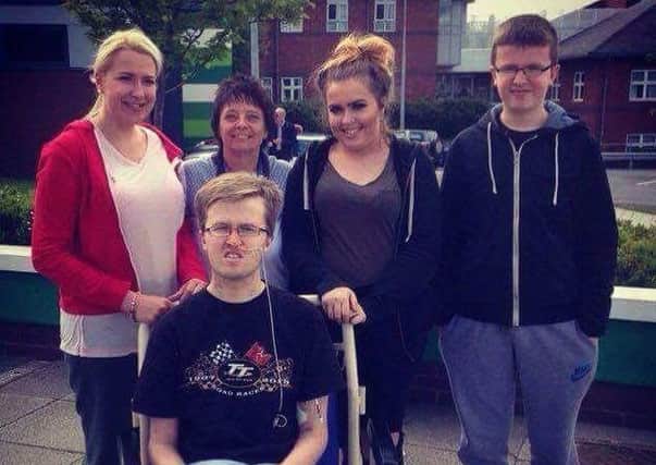 Callum Evans, 19, with his family at Manchesters Wythenshawe Hospital following a bike crash more than three months ago