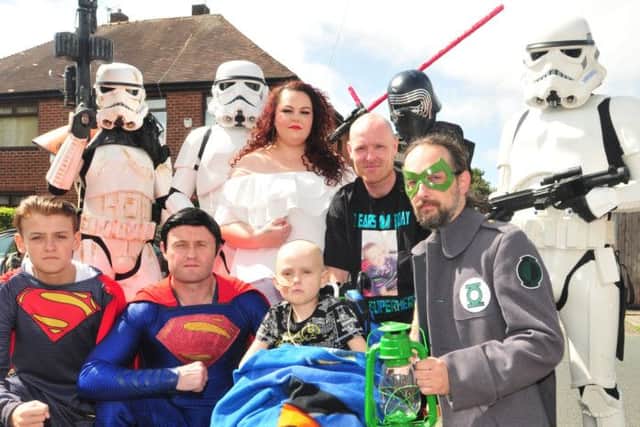 Braiden Prescott and his mum and dad were escorted into his birthday party by Stormtroopers and superheroes