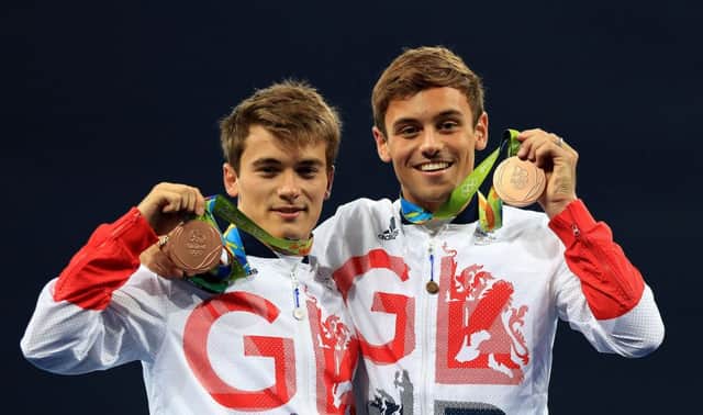 Great Britains Daniel Goodfellow and Tom Daley celebrate with their bronze medals  but is there too much sport on the TV?