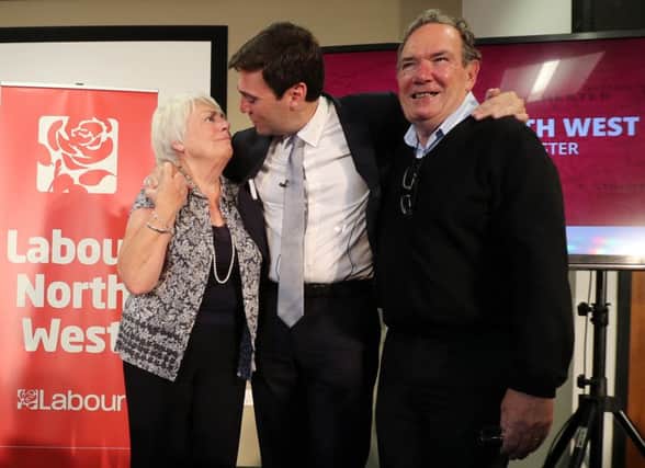 Andy Burnham hugs his parents Eileen and Roy after he was selected as the Labour candidate for mayor. See letter