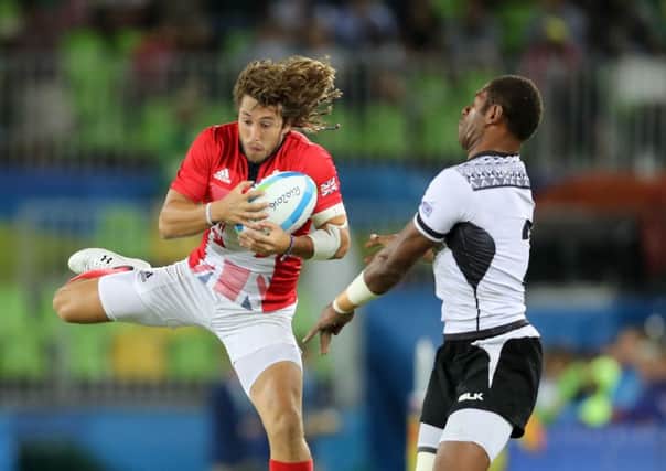 Great Britain's Daniel Bibby (left) and Fiji's Jasa Veremalua in action during the Rugby Sevens Men's Gold Medal Match