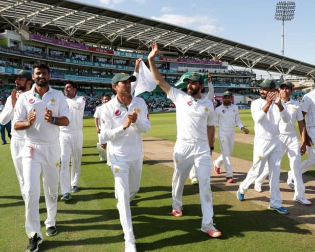 The Pakistan team walk around the ground after winning the match on day four of the fourth Test at The Oval