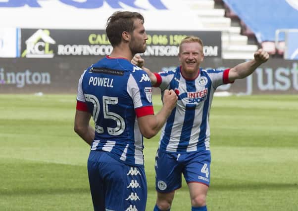 Nick Powell (left) celebrates his goal on Saturday