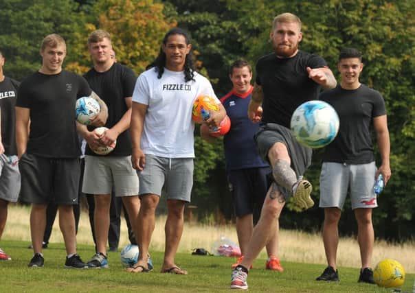 Sam Tomkins gets the game of foot-golf underway