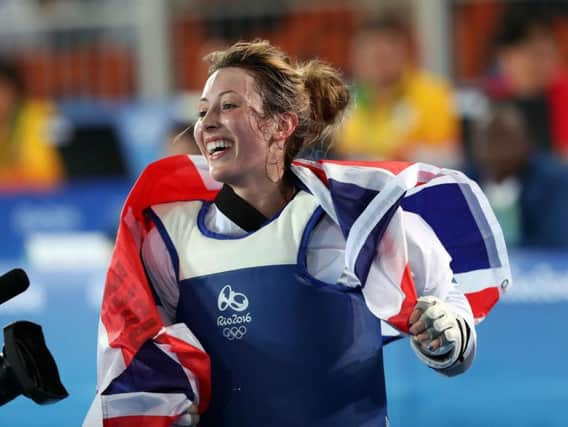 Jade Jones celebrates after defending her Olympic title