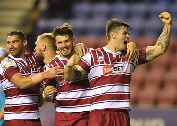Wigan celebrate a derby victory at the DW Stadium