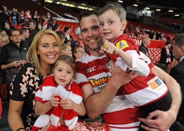 Pat Richards with his family after the 2013 Grand Final