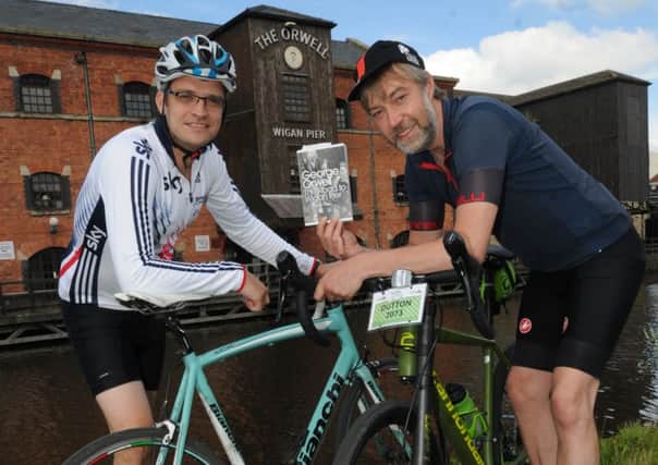 Cyclists James Gartland and Martin Dutton get ready to cycle from Wigan to Sheffield