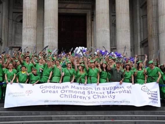 LONDON, ENGLAND - AUGUST 29: Fundraisers gather as Goodman Masson broke the Guinness World Record of the largest gathering of 'Peter Pans' in aid of Great Ormond Street Hospital at St Paul's Cathedral in August 2014. (Photo: Stuart C. Wilson/Getty Images/Goodman Masson)