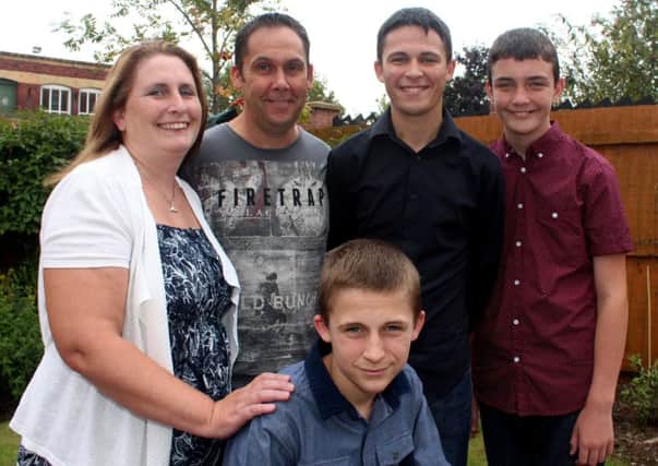 Jordan is pictured with his family, parents Meray and Paul and brothers Phil and Jack