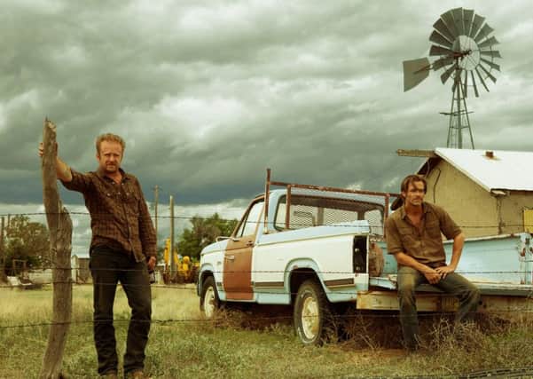 Chris Pine as Toby Howard and Ben Foster as Tanner Howard