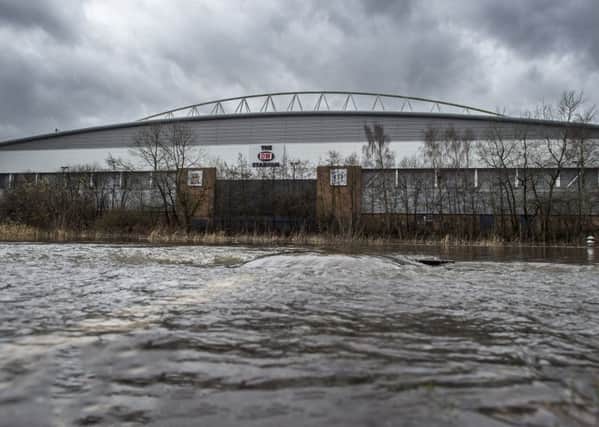 The DW Stadium looks like the seaside as an adjoining car park floods