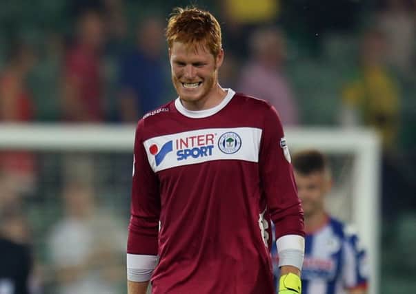Latics manager Gary Caldwell has backed Adam Bogdan to recover from his costly error at Norwich on Tuesday