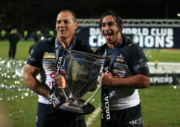 North Queensland Cowboys' co-captain's Johnathan Thurston(righT) and Matthew Scott pose with the World Club Challenge Trophy