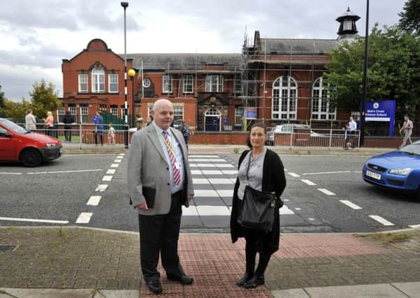 Coun Michael McLoughlin and Joanne Parkinson outside Mab's Cross Community Primary School