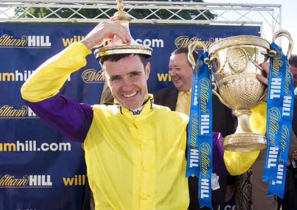 Jockey Tom Eaves celebrates winning The William Hill Ayr Gold Cup on Brando during day three of the 2016 William Hill Ayr Gold Cup Festival at Ayr Racecourse. PRESS ASSOCIATION Photo. Picture date: Saturday September 17, 2016. See PA story RACING Ayr. Photo credit should read: Craig Watson/PA Wire