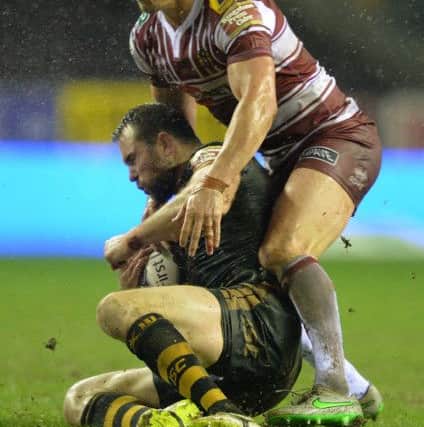 Pat Richards is tackled by his good friend and former team-mate Sean O'Loughlin at the DW in February