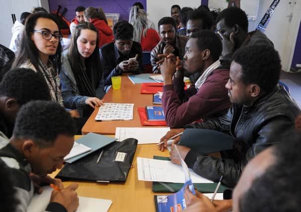 Asylum seekers at an English lesson run by the Support for Wigan Arrivals Project