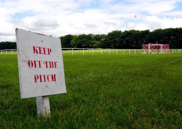 Fences have been put up around football pitches at Little Lane