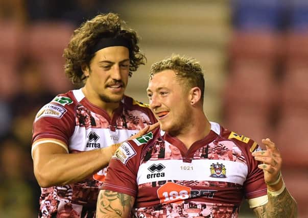 Josh Charnley is congratulated by Anthony Gelling