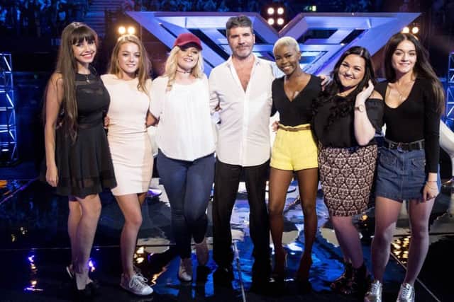 Simon Cowell with his final six (left-right) Soheila Clifford, Olivia Garcia, Caitlyn Vanbeck, Gifty Agyeman, Kayleigh Marie Morgan and Emily Middlemass