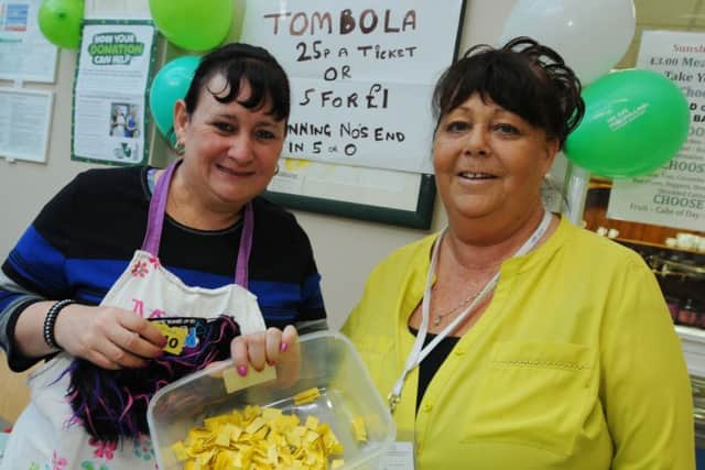 Pauline Webster and Bernadette Taylor on the tombola stall at Sunshine House