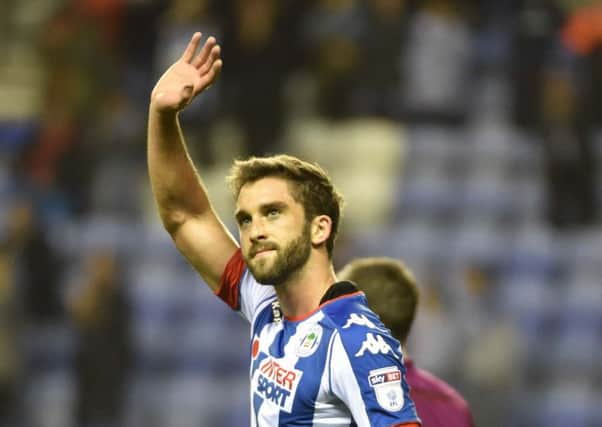 Will Grigg celebrates his winning goal for Latics against Wolves