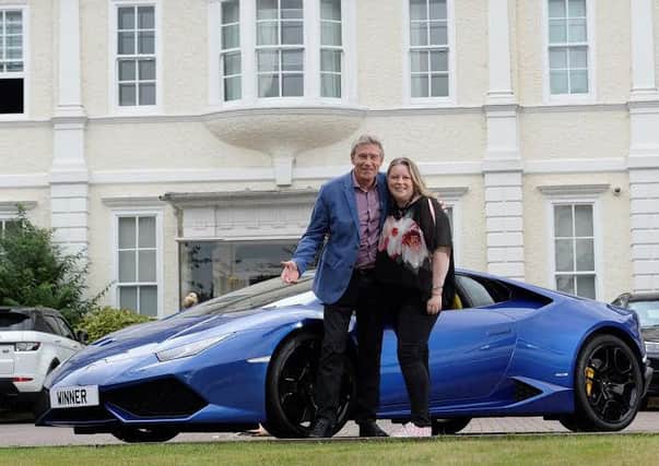 Wigan midwife Ruth Breen with Tiff and his racing car