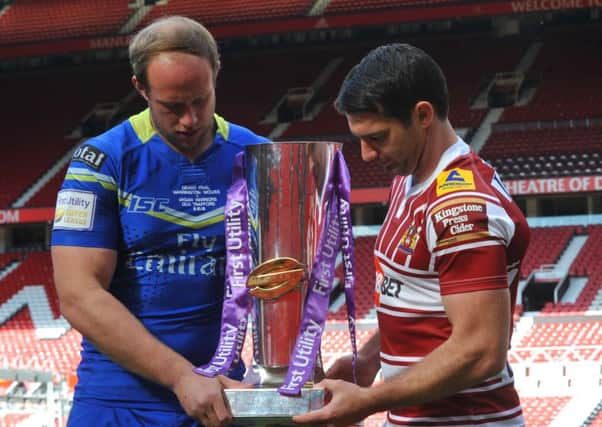 Matty Smith and Chris Hill get to grips with the trophy
