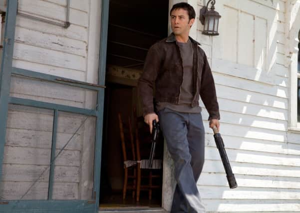 Joseph Gordon-Levitt as "Joe" in TriStar Pictures, Film District, and End Game Entertainment's action thriller LOOPER