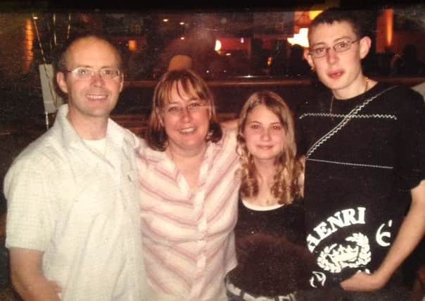 Christopher Rogers with his parents and sister